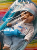 Anatomically correct boy doll w/ carrier and bottle